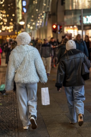 Passaten, shopping in the evening on TauentzienstraÃŸe in Berlin, Germany