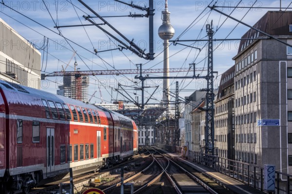 Railway line in Berlin, east of FriedrichstraÃŸe station, looking east, Berlin TV Tower, Regional Express train on the line