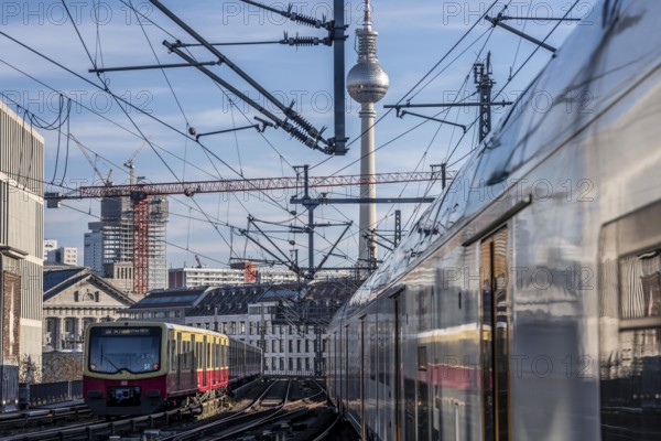 Railway line in Berlin, east of FriedrichstraÃŸe station, looking east, Berlin TV Tower, trains on the line, S-Bahn