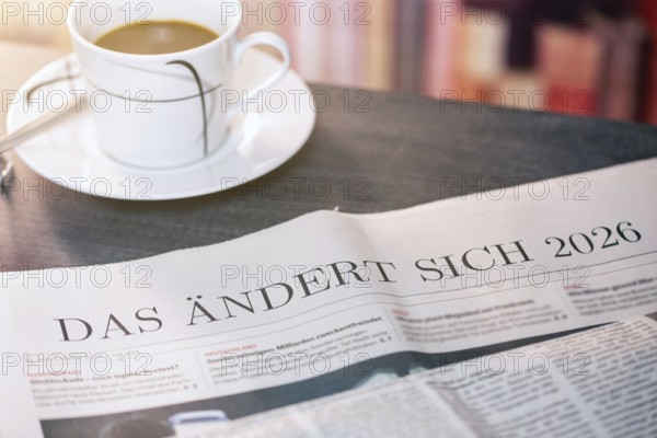 Close-up of a newspaper with the text THAT CHANGES 2026 (digitally edited)