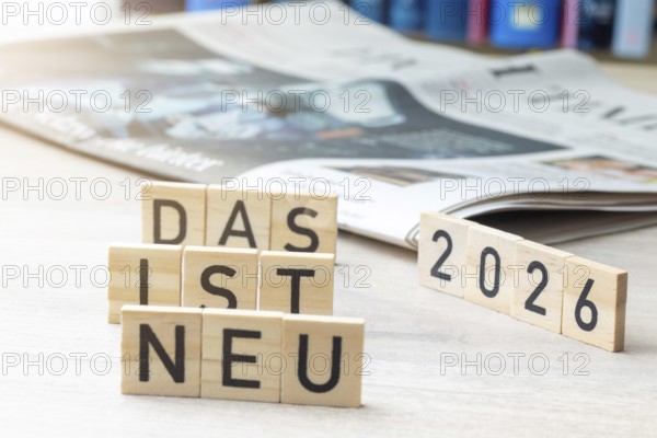 Wooden letters show the words THAT IS NEW 2026