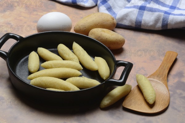 Raw Schupfnudeln in pan, type of pasta, Germany