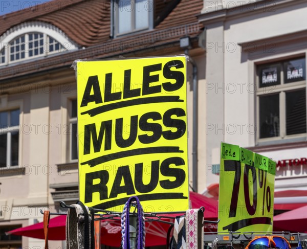 Retail trade with signs for price reductions and discounts, Potsdam, Brandenburg, Germany