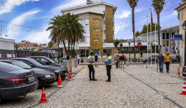 Police officers in uniform on the streets in the resort town of Cascais, Portugal
