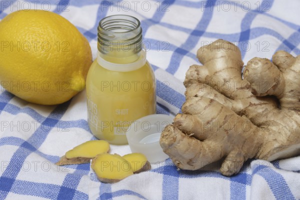 Ginger root, lemon and ginger shot