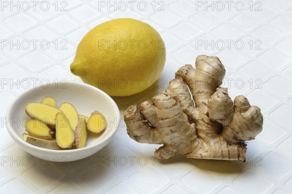 Ginger, ginger tubers and ginger slices in peel, lemon