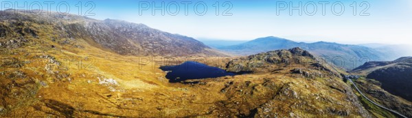 Autumn colours over Llyn Cwmffynnon and Miner's Track, Start Point, road A4086 from a drone, Pen-y-Pass, Snowdonia, Wales, UK