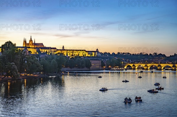 Sunset over the Vltava River, Charles Bridge and Prague Castle in Prague, Czech Republic