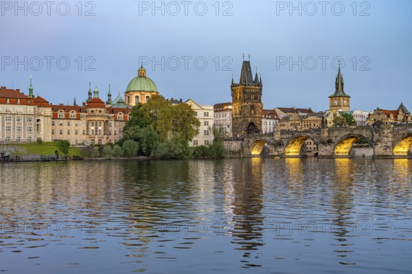 Old Town of Prague with Vltava River, Charles Bridge and Old Town Bridge Tower at dusk, Prague, Czech Republic