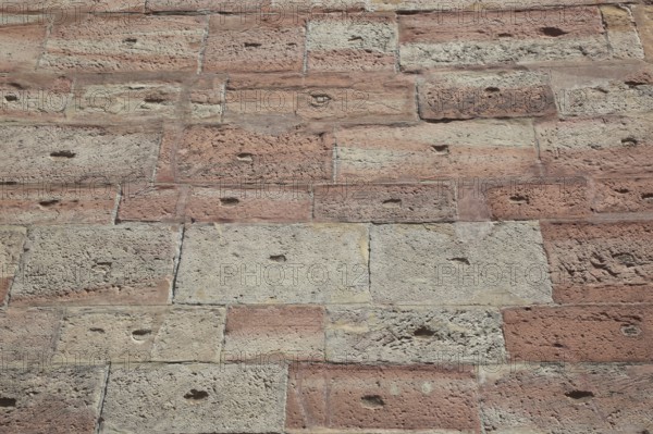 Textured brick wall in shades of red and brown with retro style