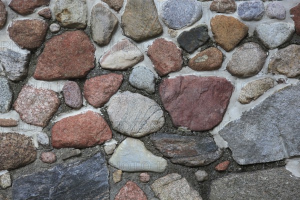 Stone wall with rough surfaces and versatile tones