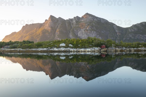 Sunset over FestvÃ¥g near BodÃ¸. Reflection of mountains in the fjord