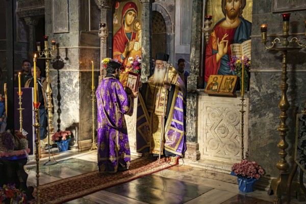 Orthodox priests at Mass on Good Friday in the Catholicon of Hosios Luke Monastery, UNESCO World Heritage Site in Steiri, Greece