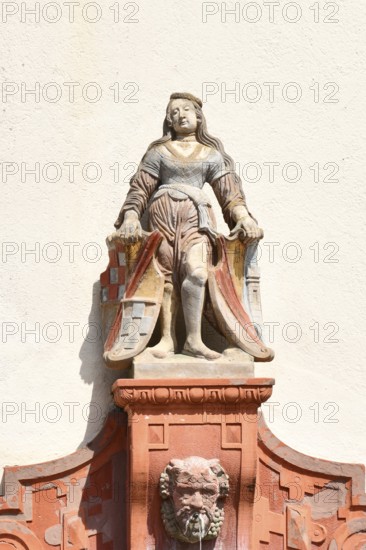 Ettlingen, Germany - August 13th: shield maiden sculpture on Fountain called 'Schildhalterin Brunnen'. Historic sandstone sculpture from the 16th century