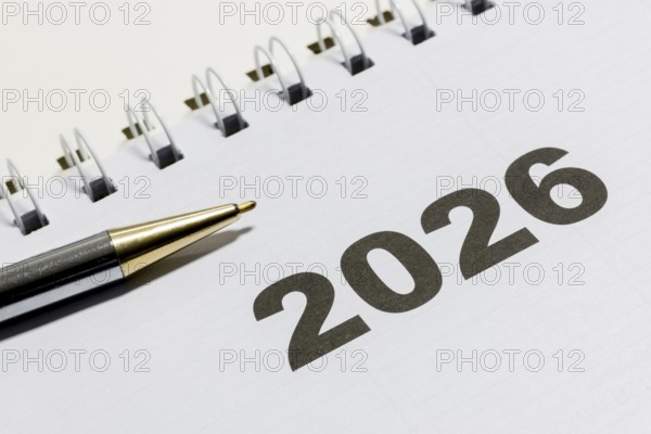 Ringbook calendar, calendar sheet for the year 2026 with a black pen next to it