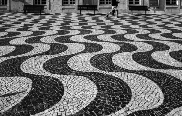 Black and white photograph, pattern of the walkway in October 5th Square, Praca 5 de Outubro, named after the 1910 revolution that led to the abolition of the monarchy in Portugal, Cascais, Portugal