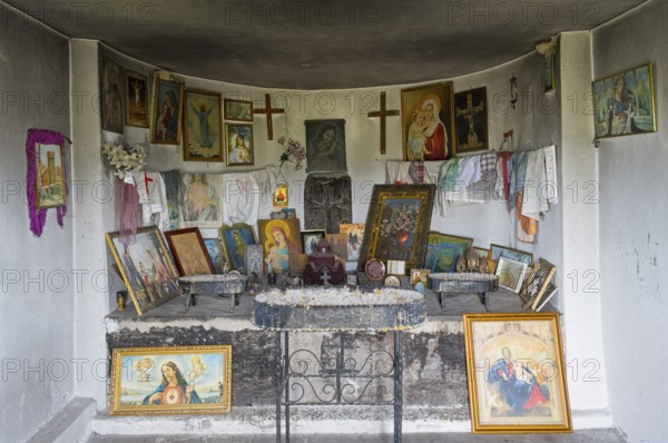 Interior view of an altar with religious icons and decorations on the walls, Holy Cross Chapel, Sarukhan, Lake Sevan, Gegharkunik Province, Armenia