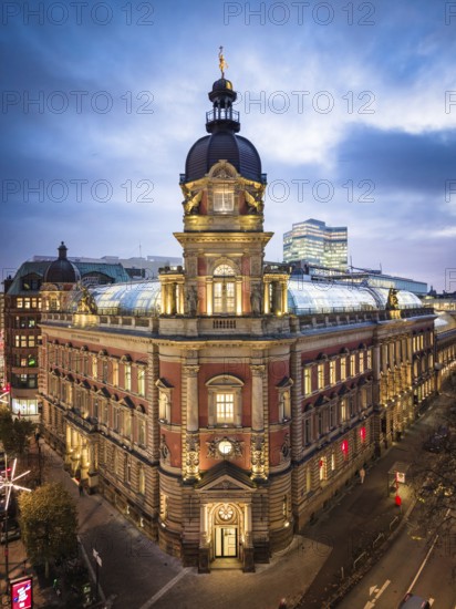 Aerial view of Old Oberpostdirektion am Stephansplatz during the blue hour with clouds in the background, Hamburg, Germany