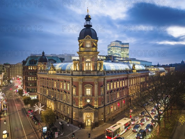 Aerial view of Old Oberpostdirektion am Stephansplatz during the blue hour with clouds in the background, Hamburg, Germany