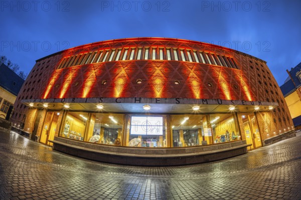 On the occasion of Orange Day, the international day against violence against woman on 25.11.2025, numerous buildings in Frankfurt am Main were illuminated in orange, including the Historical Museum, Frankfurt am Main, Hesse, Germany Germany