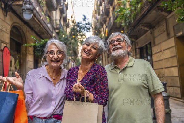 Three smiling senior friends enjoying a day of shopping, holding paper bags while walking in a lively city street, embracing leisure and an active retirement lifestyle
