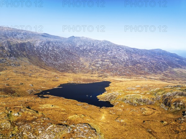 Autumn colours over Llyn Cwmffynnon and Miner's Track, Start Point, road A4086 from a drone, Pen-y-Pass, Snowdonia, Wales, UK