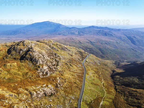 Autumn colours of Pen-y-Pass over Miner's Track, Start Point and road A4086 from a drone, Snowdonia, Wales, UK