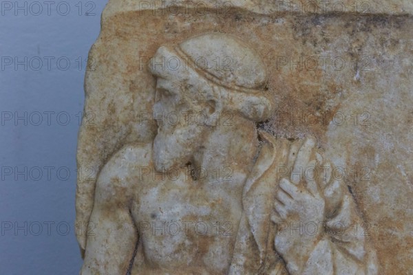 Marble relief depicting standing man, c. 460 BC, ancient stone relief with bearded man in half-sided view, Archaeological Museum, Nemea, Peloponnese, Greece