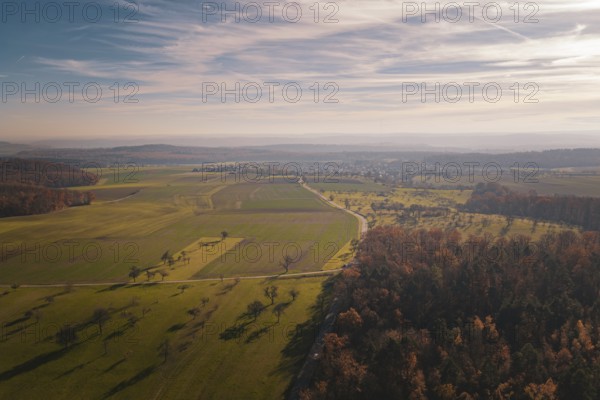 The wide view of a rural landscape with fields and a wide sky