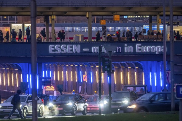 The main train station in Essen, blue-lit underpass, bus station, am Europaplatz, public transport train on the platform, North Rhine-Westphalia, Germany