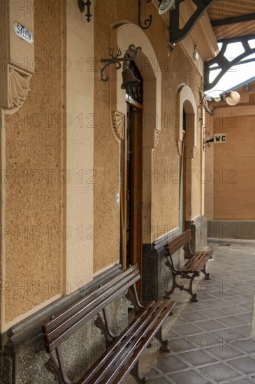 Soller train station, outer waiting area with 2 wooden benches, Majorca, Spain