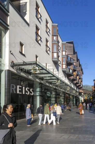 Shoppers walking past Reiss shop store in city centre, Princesshay, Exeter, Devon, England, UK