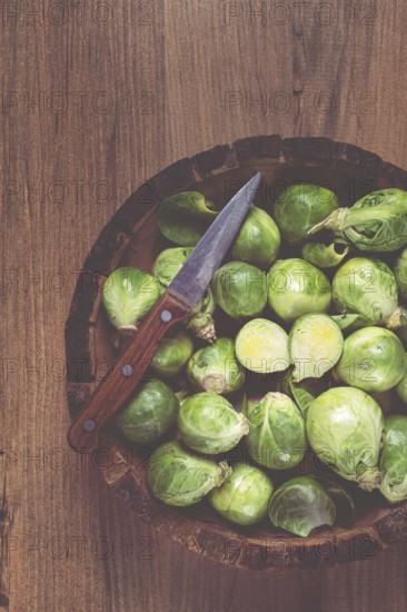 Fresh Brussels sprouts, raw, top view, on a wooden table, no people