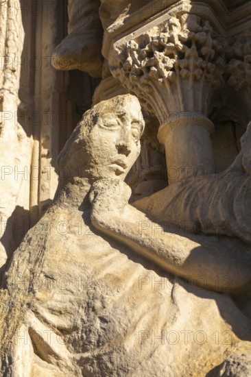 Carved stone figure on West Front of Exeter cathedral church, Exeter, Devon, England, UK