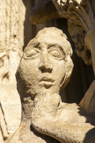 Deati lof face of carved stone figure on West Front of Exeter cathedral church, Exeter, Devon, England, UK