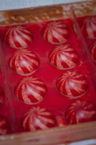 Close-up of detailed red balls in a mold, Christmas baking, Haselstaller Hof, Wildberg, Calw district, Germany