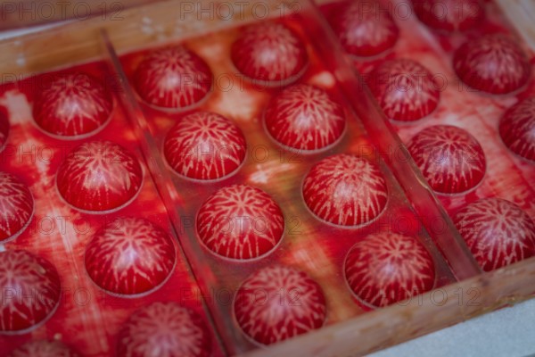 Close-up of red balls with white structures in a mold, Christmas baking, Haselstaller Hof, Wildberg, Calw district, Germany