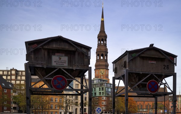 Stray silos, silo with road salt, on stilts as protection against flood and flooding, behind it the main church of St. Katharinen, St. Catherine's Church, Free and Hanseatic City of Hamburg, Germany