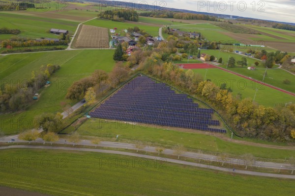 Solar system next to a village with extensive fields and surrounding landscape, construction of a PV open-air system, Weil der Stadt, Germany