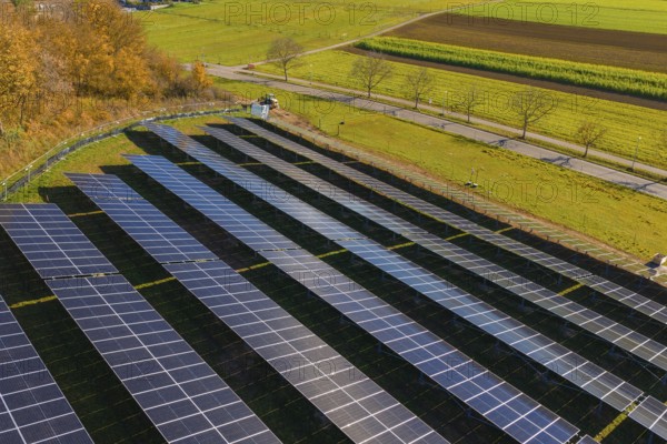 Field with solar panels shows use of technology nestled in autumn landscape, construction PV open-air plant, Weil der Stadt, Germany