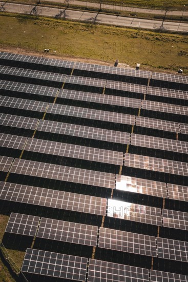 Brilliant solar modules photographed in orderly rows in the sun, PV Freifaechenanlage Bau, Weil der Stadt, Germany