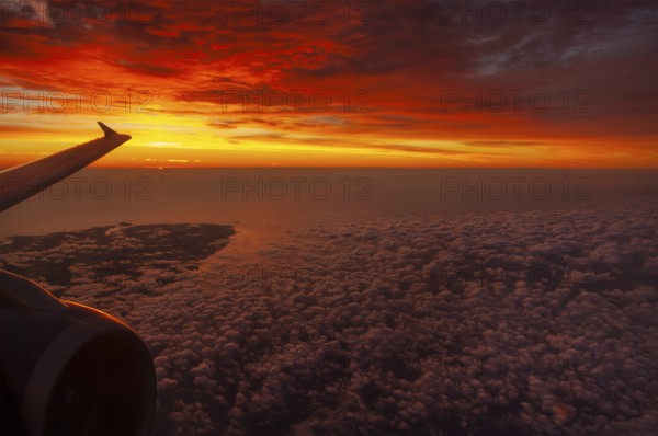 View from airplane window at sunrise