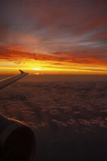 View from airplane window at sunrise