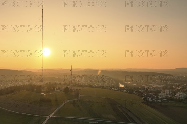 An idyllic sunset over vast fields with a dominant transmission tower, MÃ¼hlacker, Enzkreis, Germany