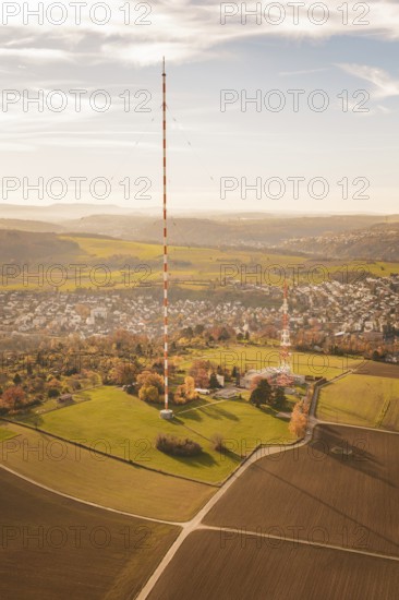 The transmission tower towers over a vast landscape with fields and villages, MÃ¼hlacker, Enzkreis, Germany