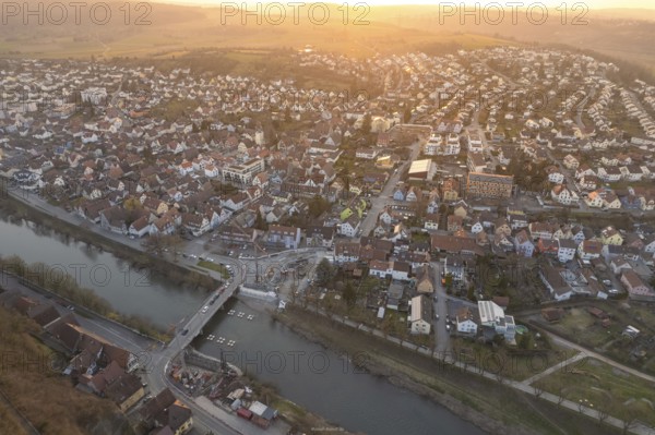 City along a river, illuminated by soft evening sun, with harmonious architecture, MÃ¼hlacker, Enzkreis, Germany