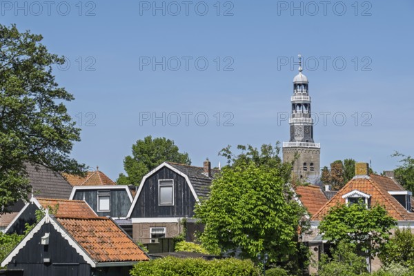 Houses and steeple of the Grote Kerk (Big Church) in Hindeloopen, Friesland, Netherlands