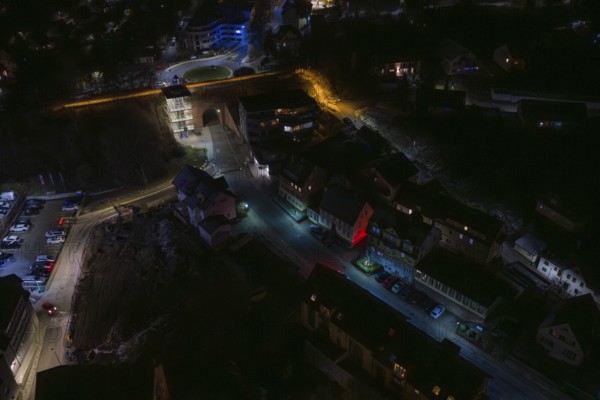 Dark street view with scattered lights and modern buildings, Nagold, Calw district, Germany