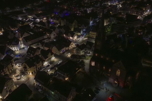 Night view with illuminated church and surrounding buildings, Nagold, Calw district, Germany