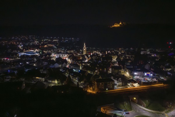 Panoramic view of illuminated city at night with church and castle in the background, Nagold, Calw district, Germany